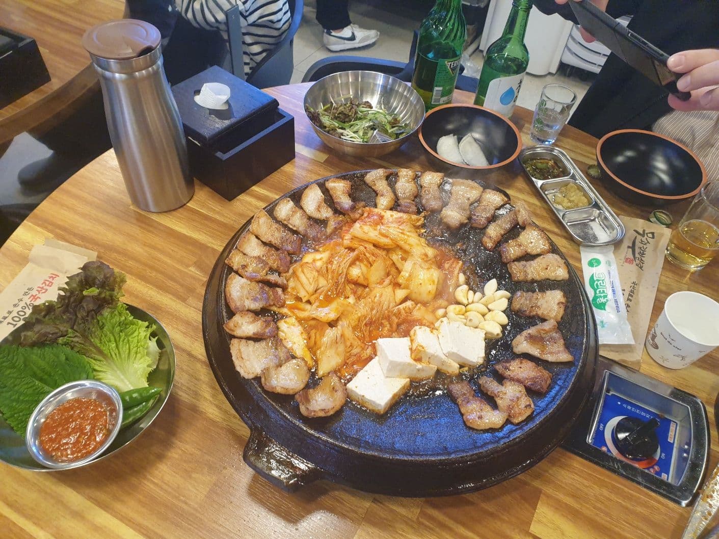 Kimchi, tofu, and garlic fried in a golden pond of "collagen"
